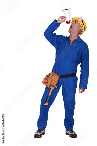 Photo: Builder shouting orders through megaphone Builder shouting orders through megaphone