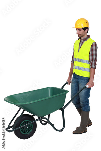 Photo: bricklayer and wheelbarrow bricklayer and wheelbarrow