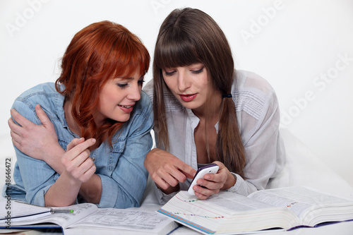 Photo: female students working together female students working together
