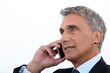 Mature businessman using a cellphone