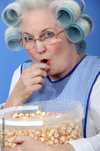 Photo: Granny eating caramel popcorn Granny eating caramel popcorn