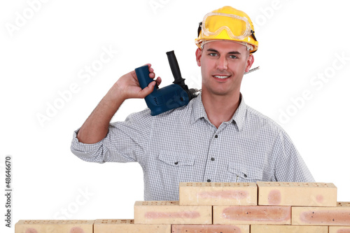 Photo: A mason with a drill. A mason with a drill.