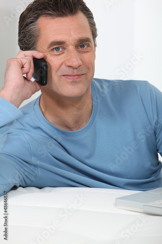 Photo: Casual older man on the phone Casual older man on the phone