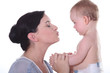 Mother kissing little baby