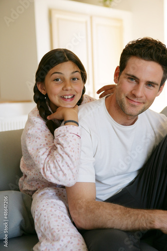 Photo: Father and daughter chilling-out on the sofa Father and daughter chilling-out on the sofa