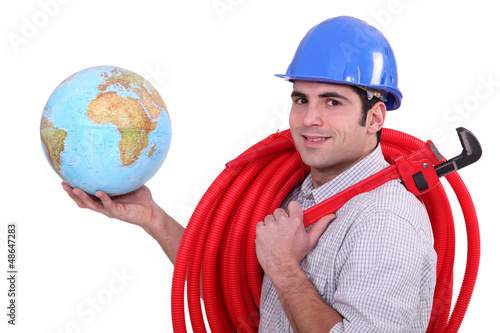 Photo: Tradesman holding a globe Tradesman holding a globe