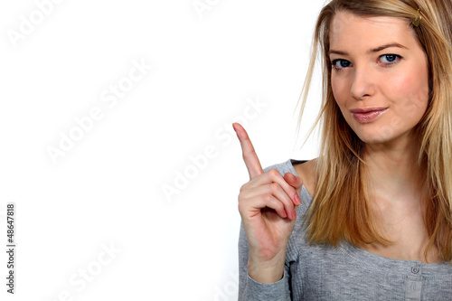 Photo: Woman raising her finger Woman raising her finger