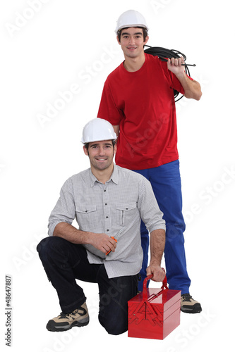 Photo: Plumber and electrician working as team Plumber and electrician working as team