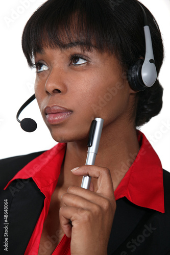 Photo: Afro-American woman wearing a headset Afro-American woman wearing a headset