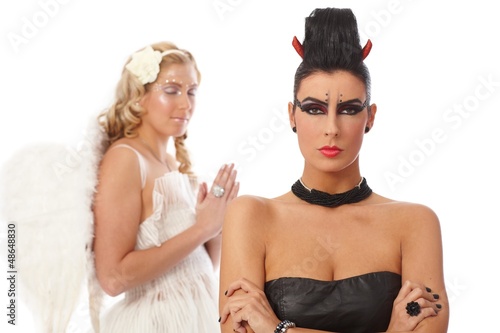 Photo: Woman devil standing arms crossed Woman devil standing arms crossed