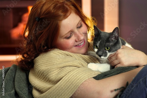 Photo: Happy redhead girl with cat Happy redhead girl with cat