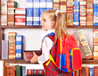 Child with stack book.