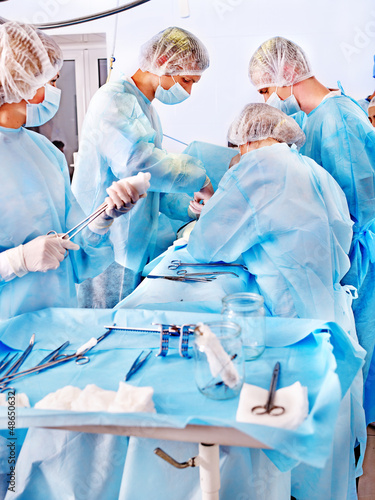 Photo: Surgeon at work in operating room. Surgeon at work in operating room.