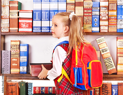 Photo: Child with stack book. Child with stack book.