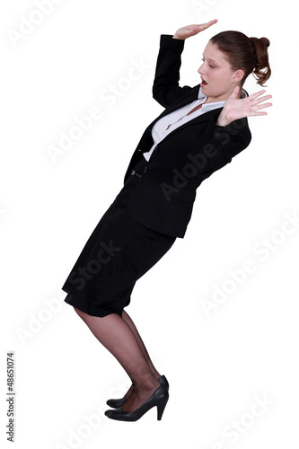 Photo: Businesswoman struggling to keep balance Businesswoman struggling to keep balance