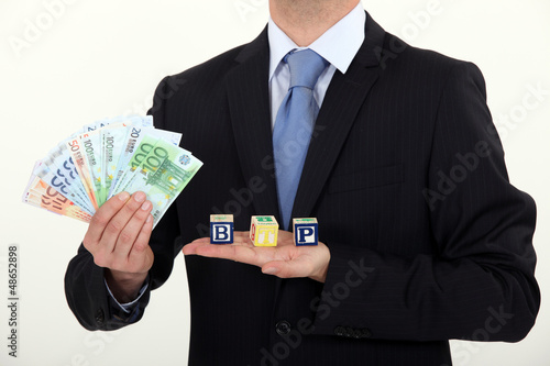 Photo: Male hands on ticket Male hands on ticket