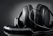 Modern headphones over dark background