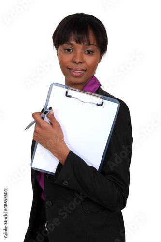 Photo: Woman holding a clipboard Woman holding a clipboard