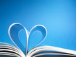 pages of a book curved into a heart shape