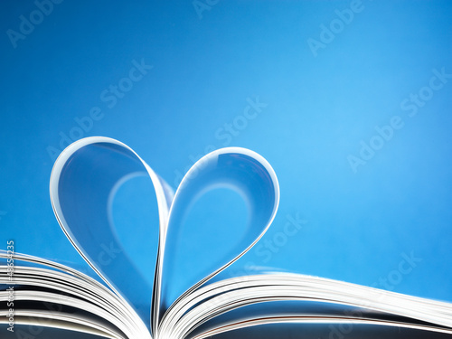 Photo: pages of a book curved into a heart shape pages of a book curved into a heart shape