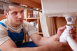 Plumber fixing sink