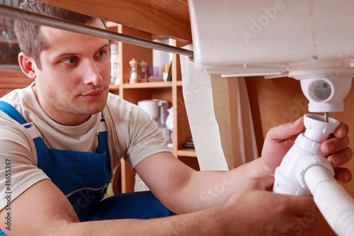 Photo: Plumber fixing sink Plumber fixing sink