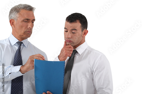 Photo: Businessman discussing a document Businessman discussing a document