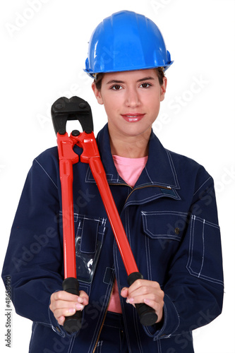 Photo: Women with pliers resting on the shoulder Women with pliers resting on the shoulder