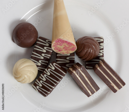 Photo: delicious chocolate candies in a bowl delicious chocolate candies in a bowl
