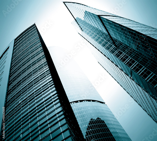Photo: modern glass silhouettes of skyscrapers at night modern glass silhouettes of skyscrapers at night