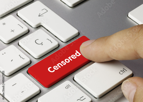 Photo: Censored keyboard key. Finger Censored keyboard key. Finger