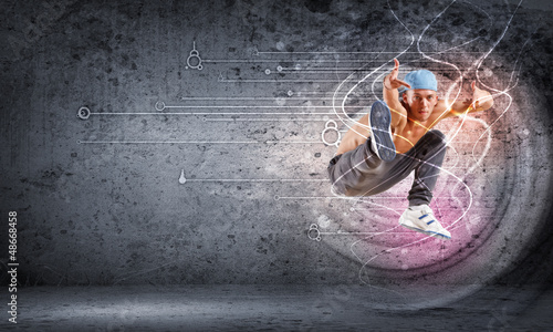 Photo: young man dancing hip hop with color lines young man dancing hip hop with color lines
