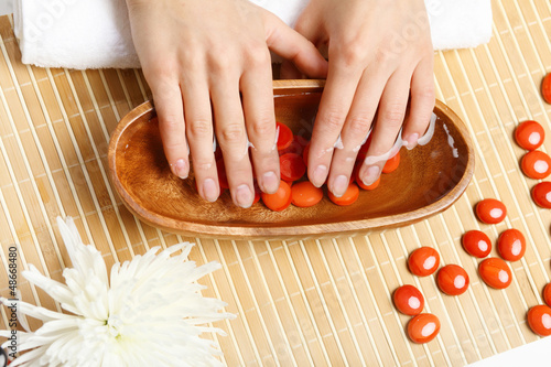 Photo: Woman is getting manicure Woman is getting manicure