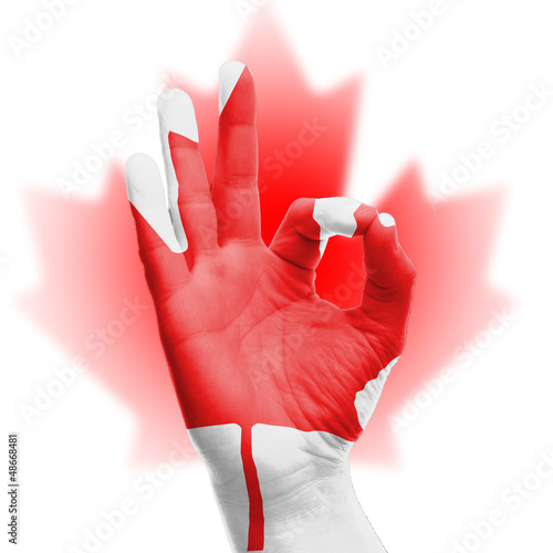 Photo: hand OK sign with Canadian flag hand OK sign with Canadian flag