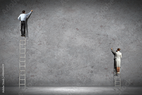 Photo: businesspeople drawing diagrams on wall businesspeople drawing diagrams on wall