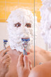 man is preparing to shave