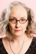 serious woman portrait pink background real people high definiti
