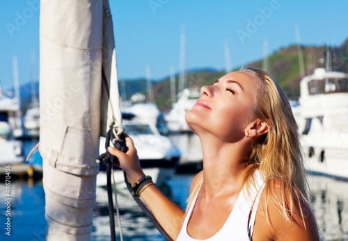Photo: Woman tanning on luxury yacht Woman tanning on luxury yacht