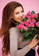 Laughing romantic woman with roses