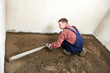 Plasterer concrete worker at floor work