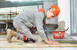 tiler at industrial floor tiling renovation work