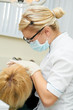 Photo: dentist doctor at teeth treatment work dentist doctor at teeth treatment work
