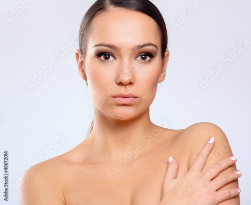 Photo: Close-up portrait of woman, isolated on white background Close-up portrait of woman, isolated on white background