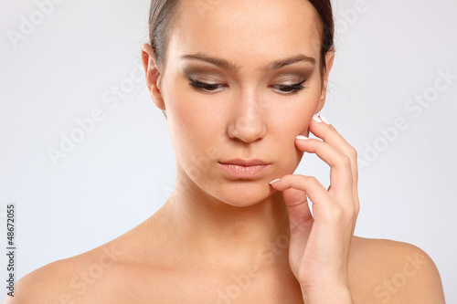Photo: Close-up portrait of woman, isolated on white background Close-up portrait of woman, isolated on white background