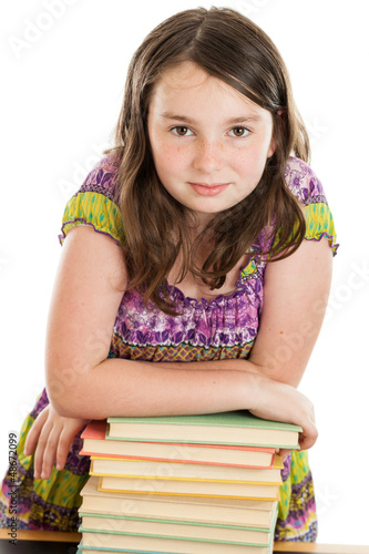 Photo: Elementary School Girl on Leaning on Stack of Books Elementary School Girl on Leaning on Stack of Books