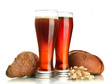 two glasses of kvass and rye breads with ears, isolated on
