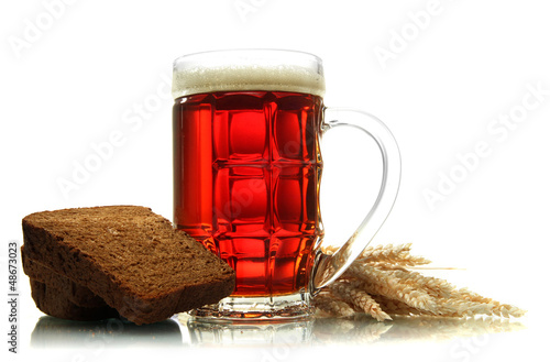 Photo: tankard of kvass and rye breads with ears, isolated on white tankard of kvass and rye breads with ears, isolated on white