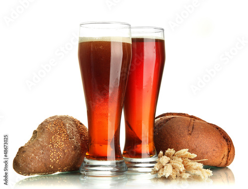 Photo: two glasses of kvass and rye breads with ears, isolated on two glasses of kvass and rye breads with ears, isolated on