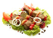 tasty grilled meat and vegetables on skewers, isolated on white