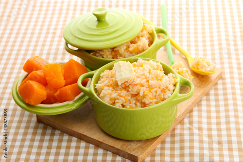 Photo: Taste rice porridge with pumpkin in saucepans Taste rice porridge with pumpkin in saucepans
